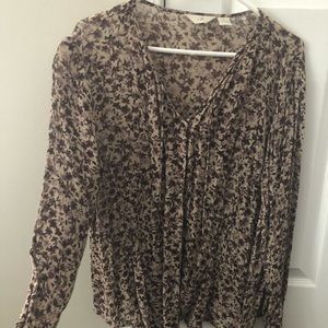 Cute, shear floral long sleeve blouse.